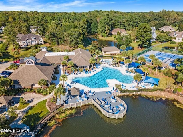 birds eye view of property with a residential view, a water view, and a forest view