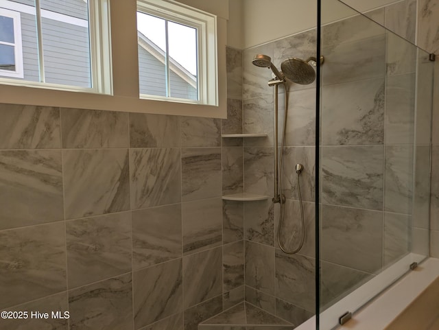 bathroom with tiled shower