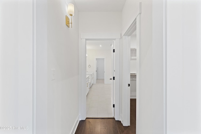 hall with dark wood-type flooring