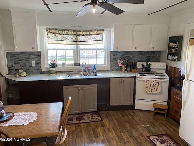 kitchen with dark wood-type flooring, white cabinetry, sink, and white appliances