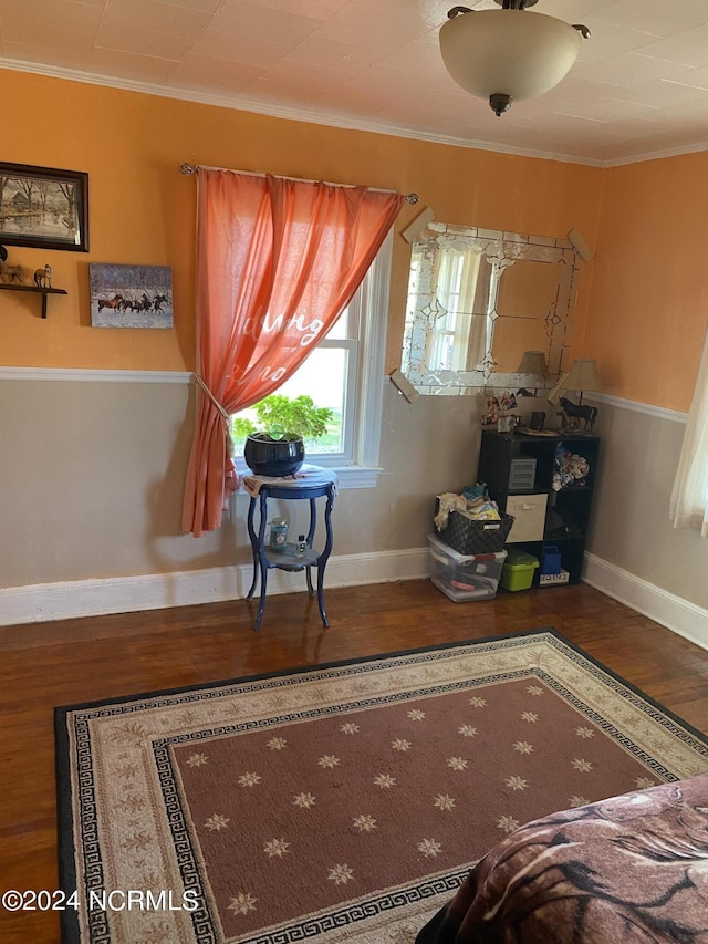 sitting room featuring crown molding and hardwood / wood-style floors