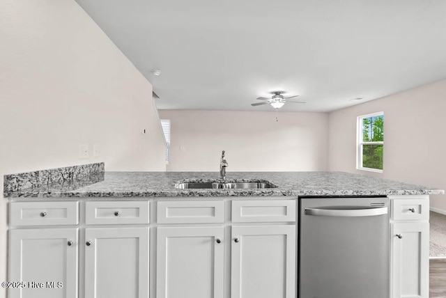 kitchen featuring ceiling fan, dishwasher, white cabinets, and sink