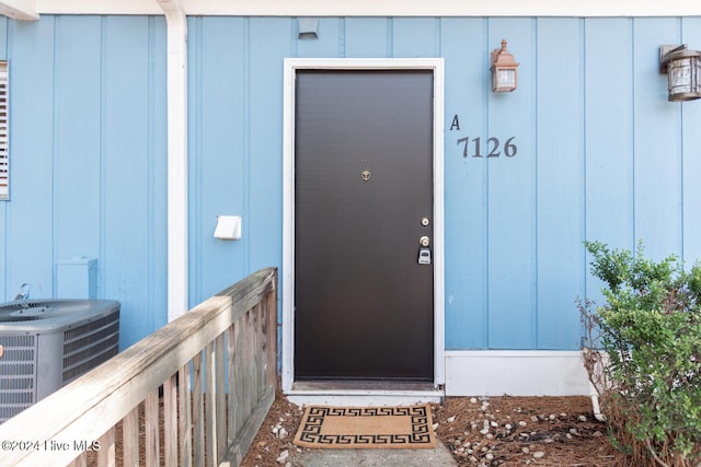 property entrance with central AC unit