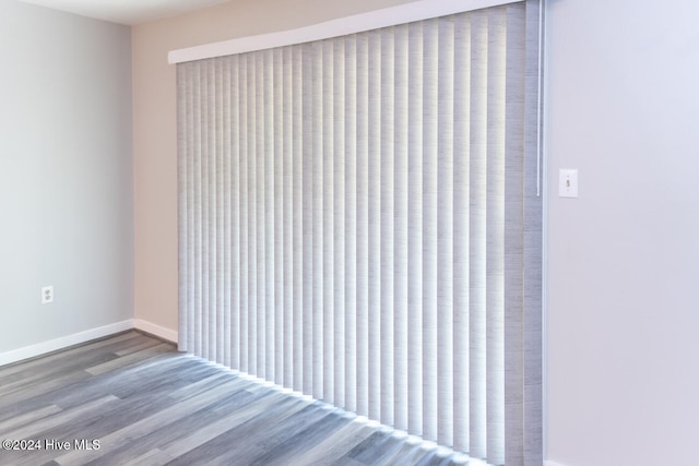 empty room with hardwood / wood-style flooring