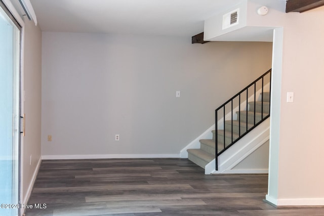 stairs with hardwood / wood-style flooring