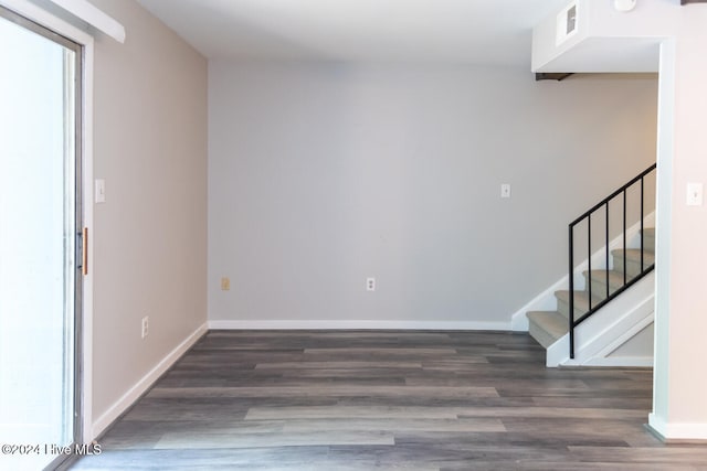 spare room featuring dark hardwood / wood-style floors