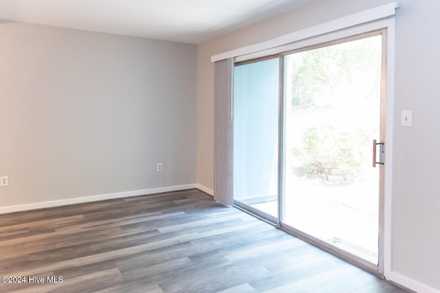 empty room with dark wood-type flooring