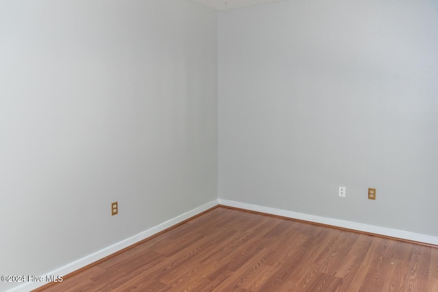 empty room with wood-type flooring