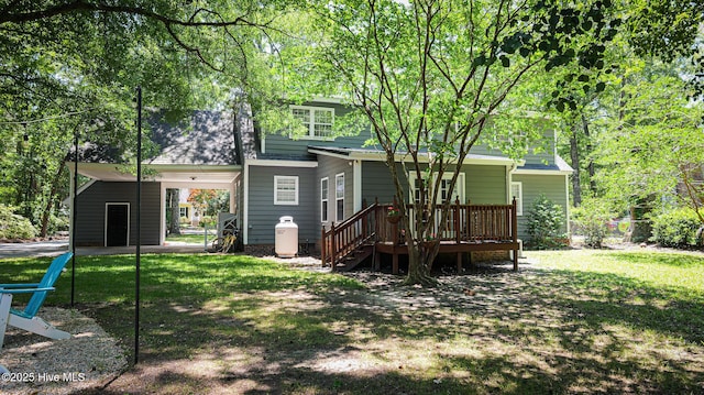 back of house with a lawn