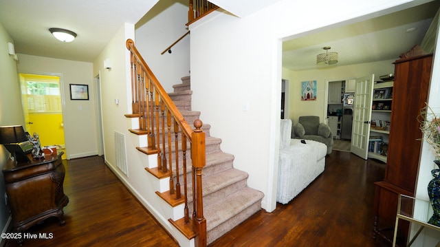 stairs with hardwood / wood-style flooring