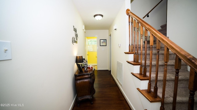 corridor featuring dark wood-type flooring