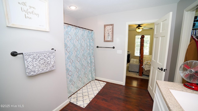 bathroom featuring ceiling fan, wood-type flooring, and vanity