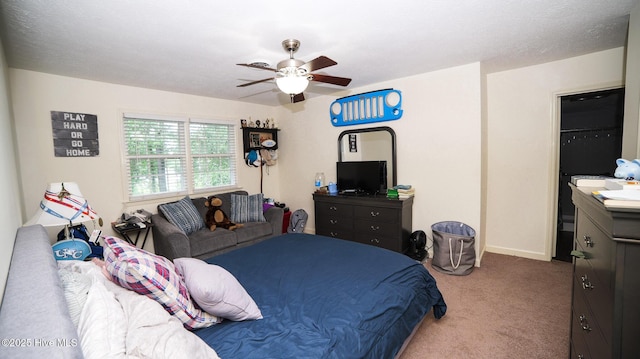 bedroom featuring ceiling fan and carpet flooring