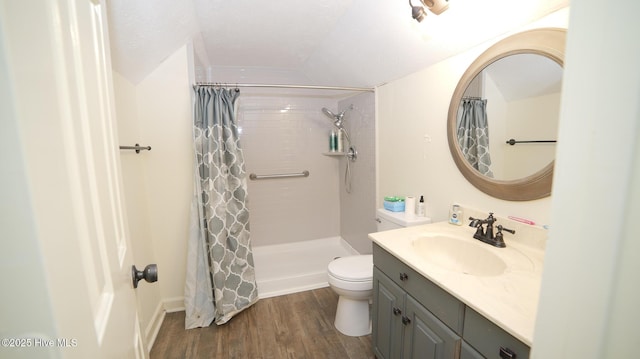 bathroom with toilet, hardwood / wood-style floors, a shower with shower curtain, a textured ceiling, and vanity