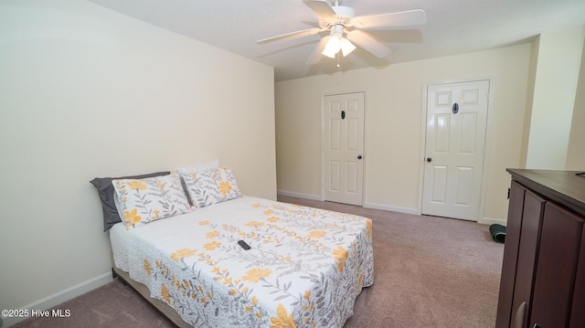 bedroom featuring ceiling fan and carpet