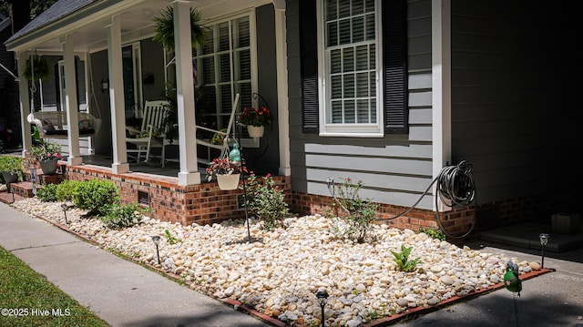 property entrance with covered porch