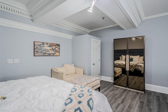 bedroom with crown molding, a closet, and dark hardwood / wood-style flooring