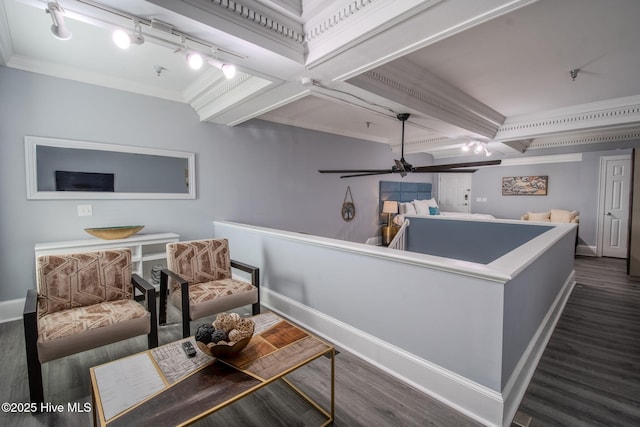 interior space with ceiling fan, dark hardwood / wood-style flooring, crown molding, and coffered ceiling