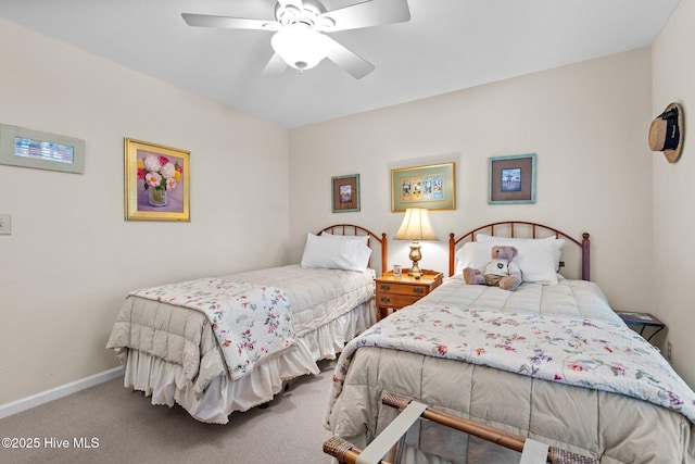 bedroom featuring ceiling fan and carpet