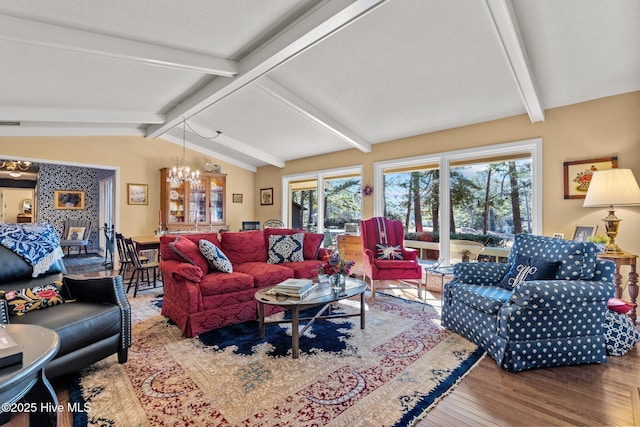 living room featuring hardwood / wood-style flooring, vaulted ceiling with beams, and a notable chandelier