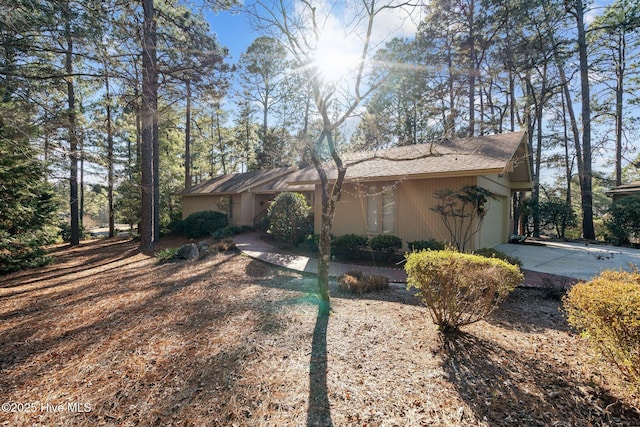 view of side of property featuring a garage