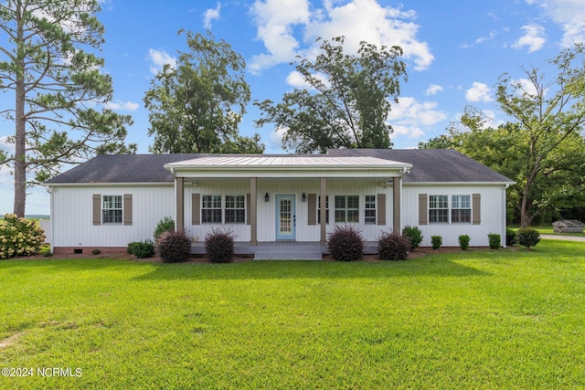 ranch-style home with covered porch and a front lawn