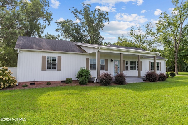 ranch-style home featuring a front yard and a porch