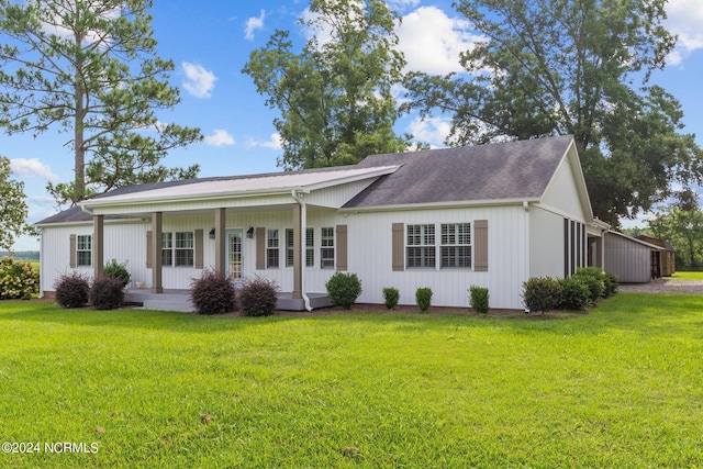 ranch-style home with a front yard and a porch