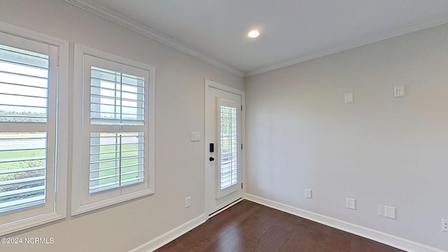 entryway featuring dark hardwood / wood-style flooring and crown molding