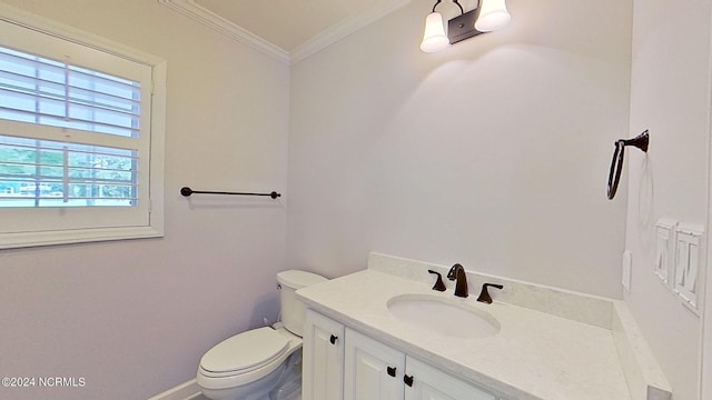 bathroom featuring toilet, crown molding, and vanity