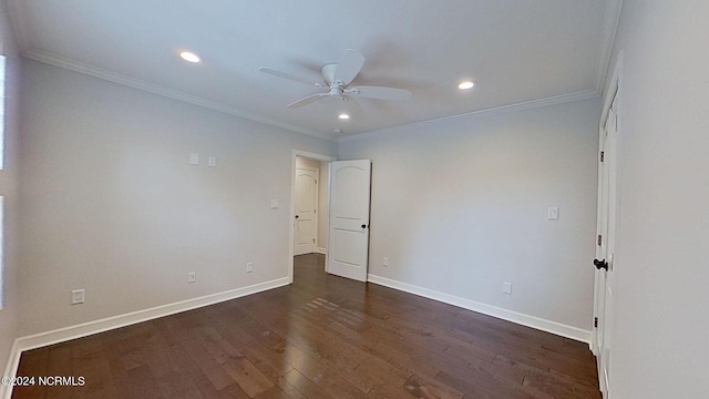 empty room with ceiling fan, crown molding, and dark hardwood / wood-style floors