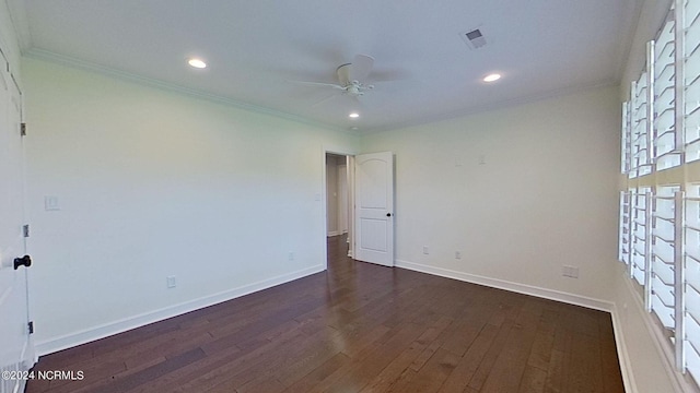 empty room with ceiling fan, crown molding, and dark hardwood / wood-style floors