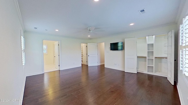 unfurnished bedroom with ceiling fan, dark wood-type flooring, and ornamental molding