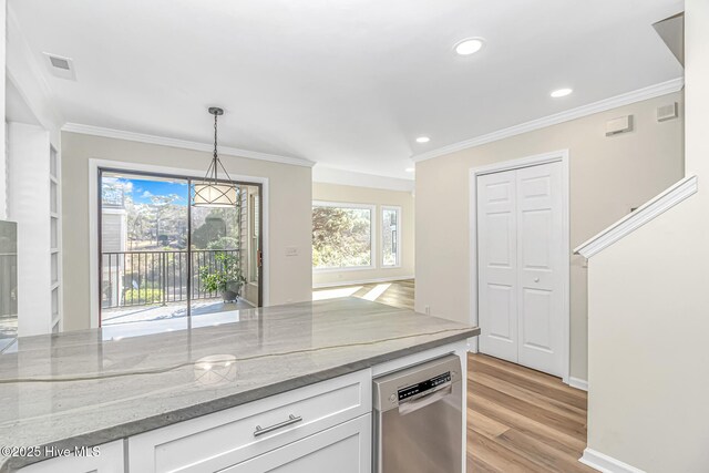 kitchen featuring light stone countertops, white cabinets, appliances with stainless steel finishes, and sink