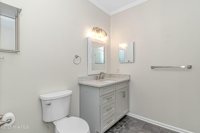 bathroom with toilet, vanity, tile patterned flooring, and crown molding