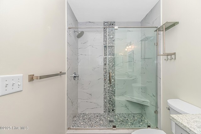bathroom with toilet, tile patterned floors, and vanity
