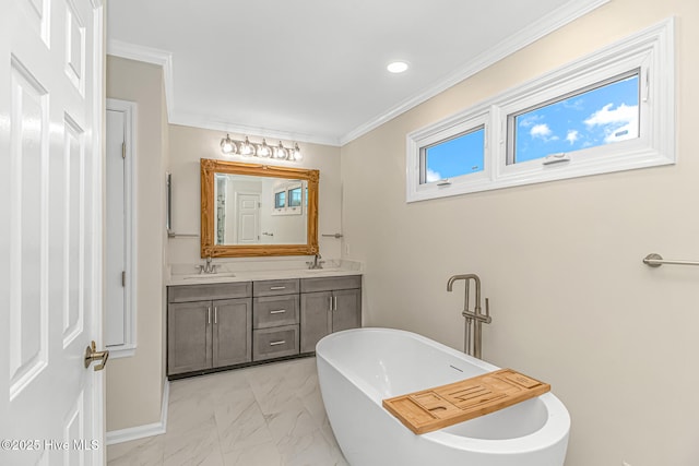 bathroom featuring a tub, vanity, and ornamental molding