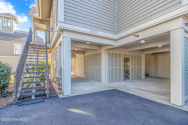 view of exterior entry with a carport