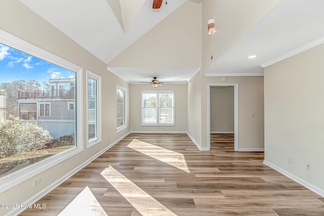 interior space featuring ceiling fan and lofted ceiling