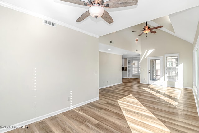 unfurnished living room featuring crown molding, lofted ceiling, and light hardwood / wood-style floors