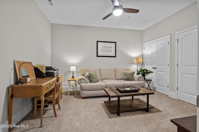 living room with carpet and ceiling fan