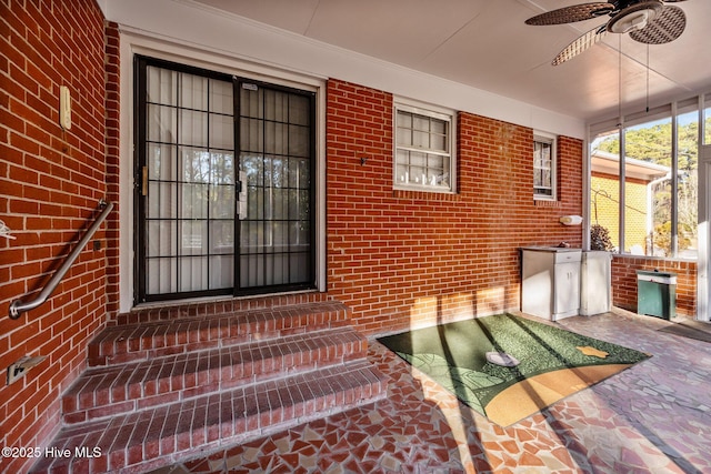 property entrance with ceiling fan