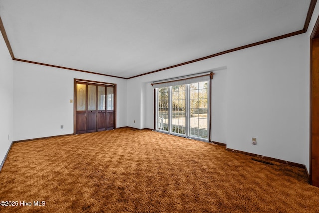 carpeted spare room featuring ornamental molding