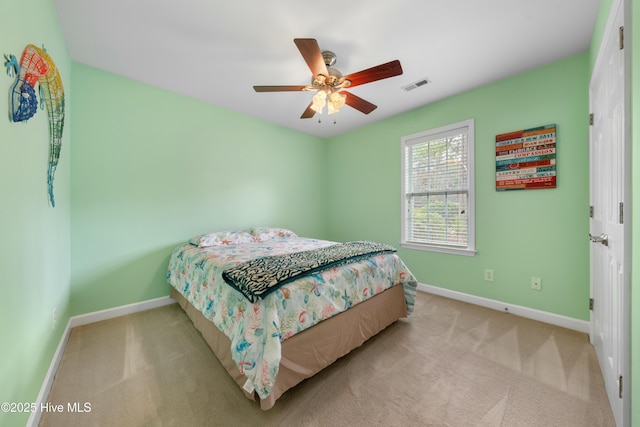 bedroom featuring light carpet and ceiling fan