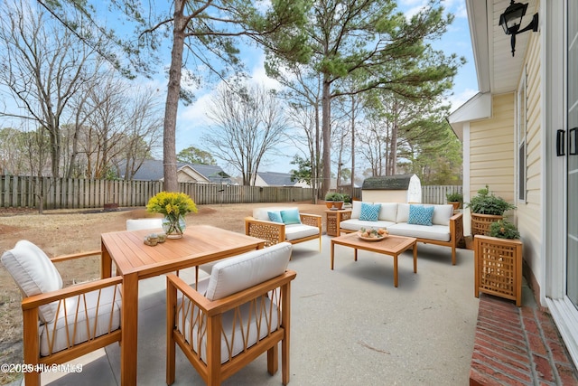 view of patio / terrace featuring a storage shed and outdoor lounge area