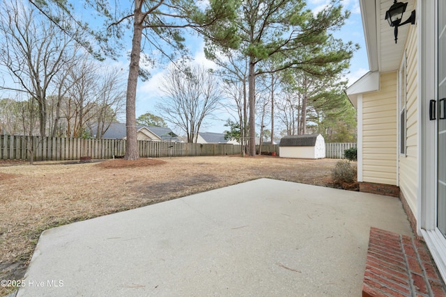 view of patio with a storage shed