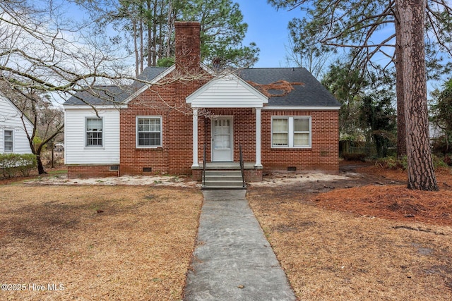 bungalow-style home with a front yard