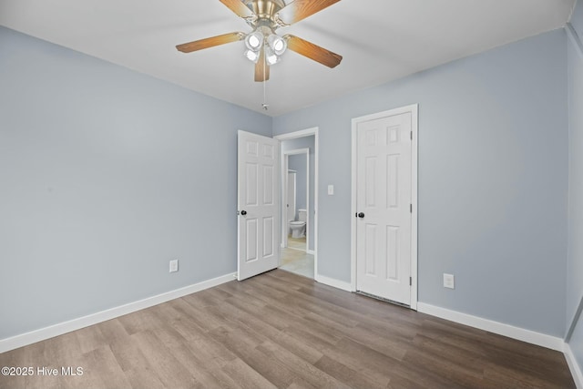 unfurnished bedroom featuring ceiling fan and light wood-type flooring