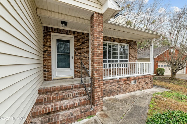 entrance to property with a porch