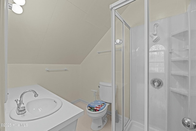 bathroom with an enclosed shower, vanity, vaulted ceiling, and toilet